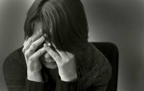 a black and white image where boy feeling depressed